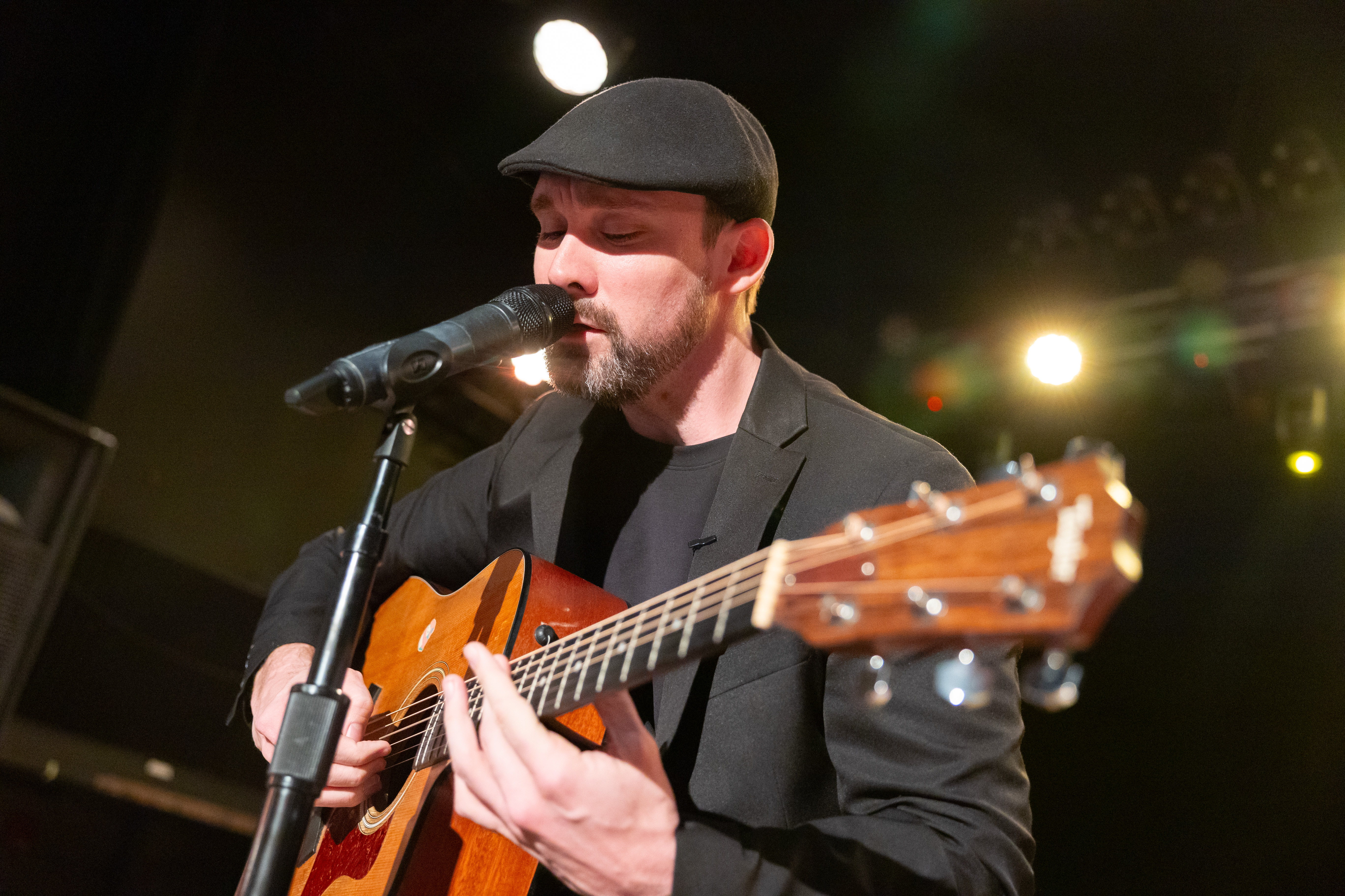 Chris Hendricks performing music on stage